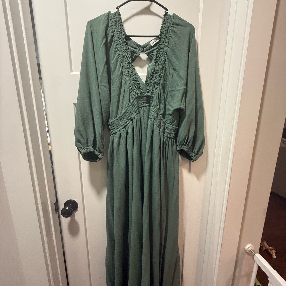 In loom flowing green deep V neck dress.
